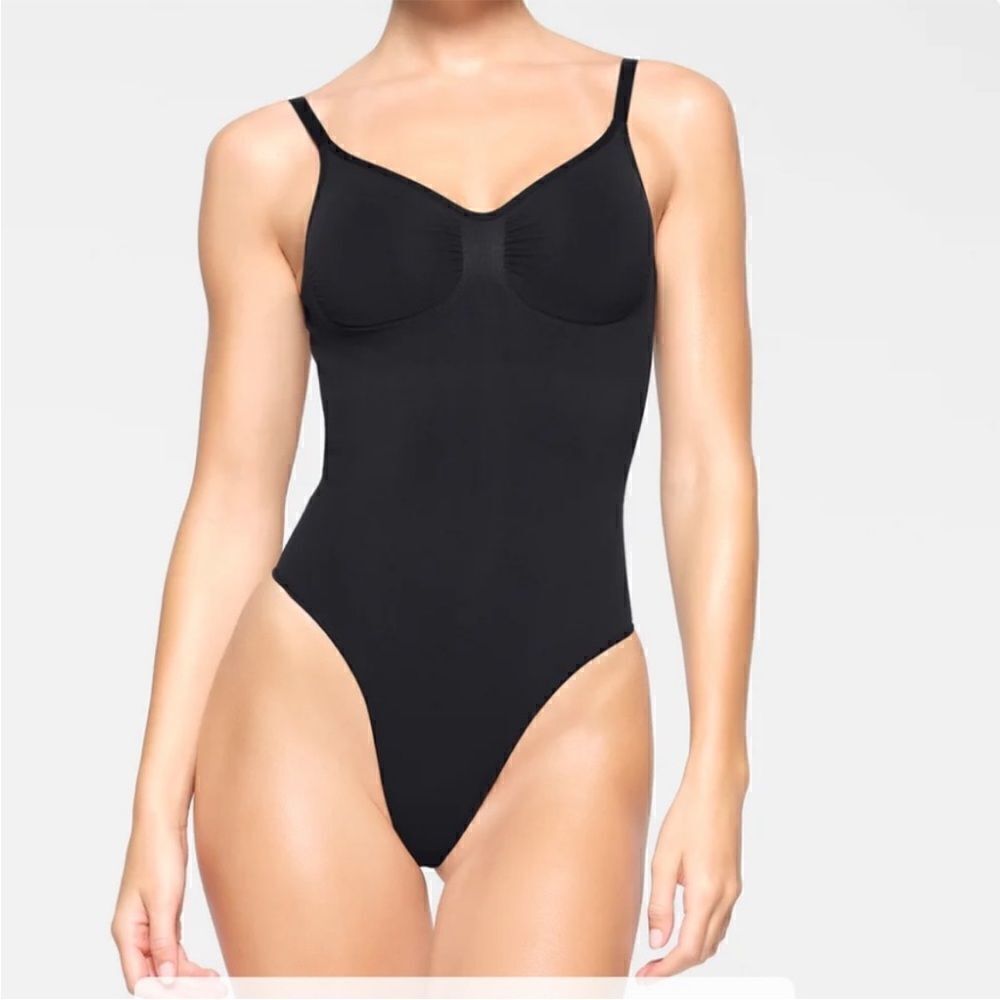 SKIMS sculpting bodysuit in onyx thong